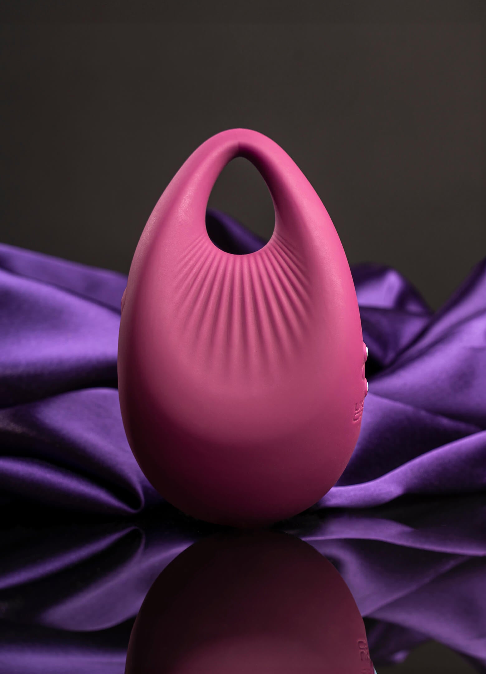 Pear shaped burgundy finger vibrator.