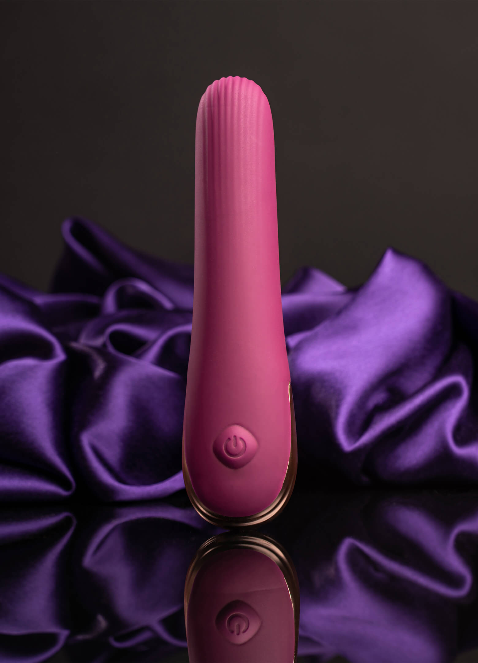 Small discreet burgundy vibrator with a ribbed tip.