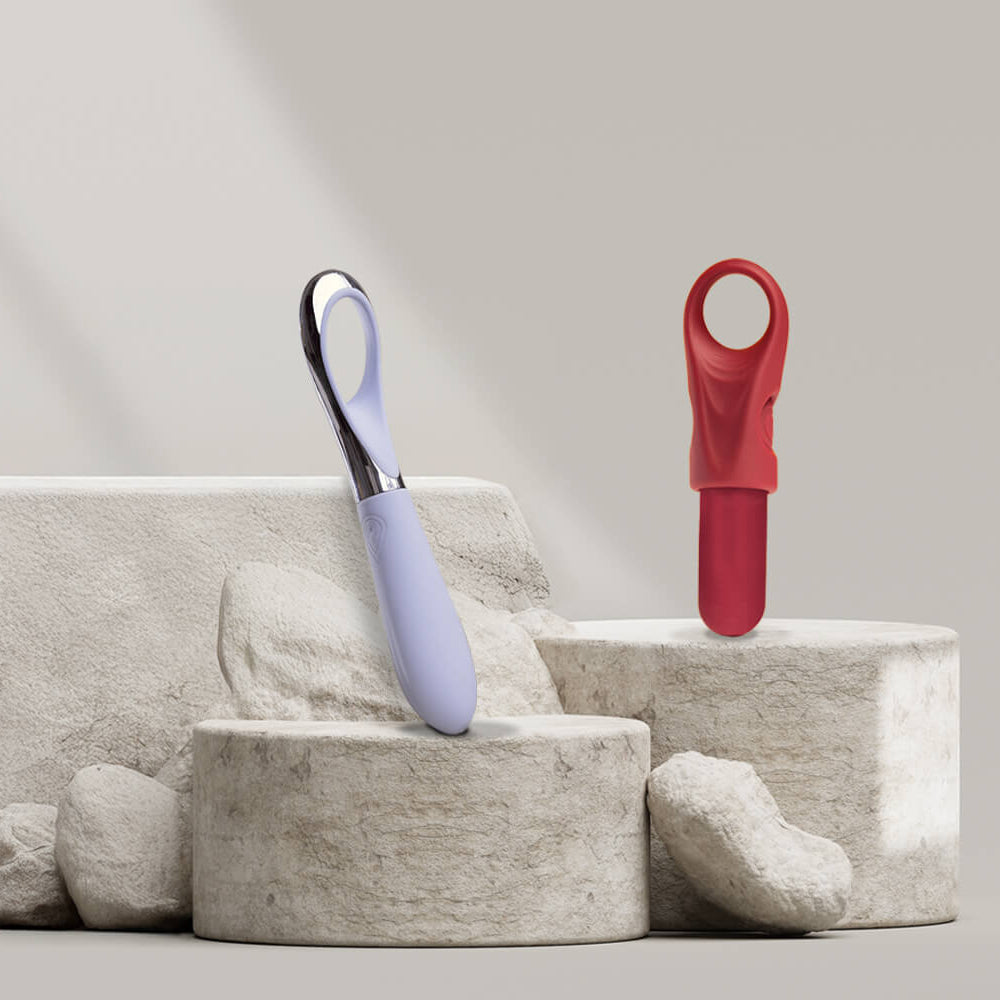 Collection of finger vibrators on a stone podium