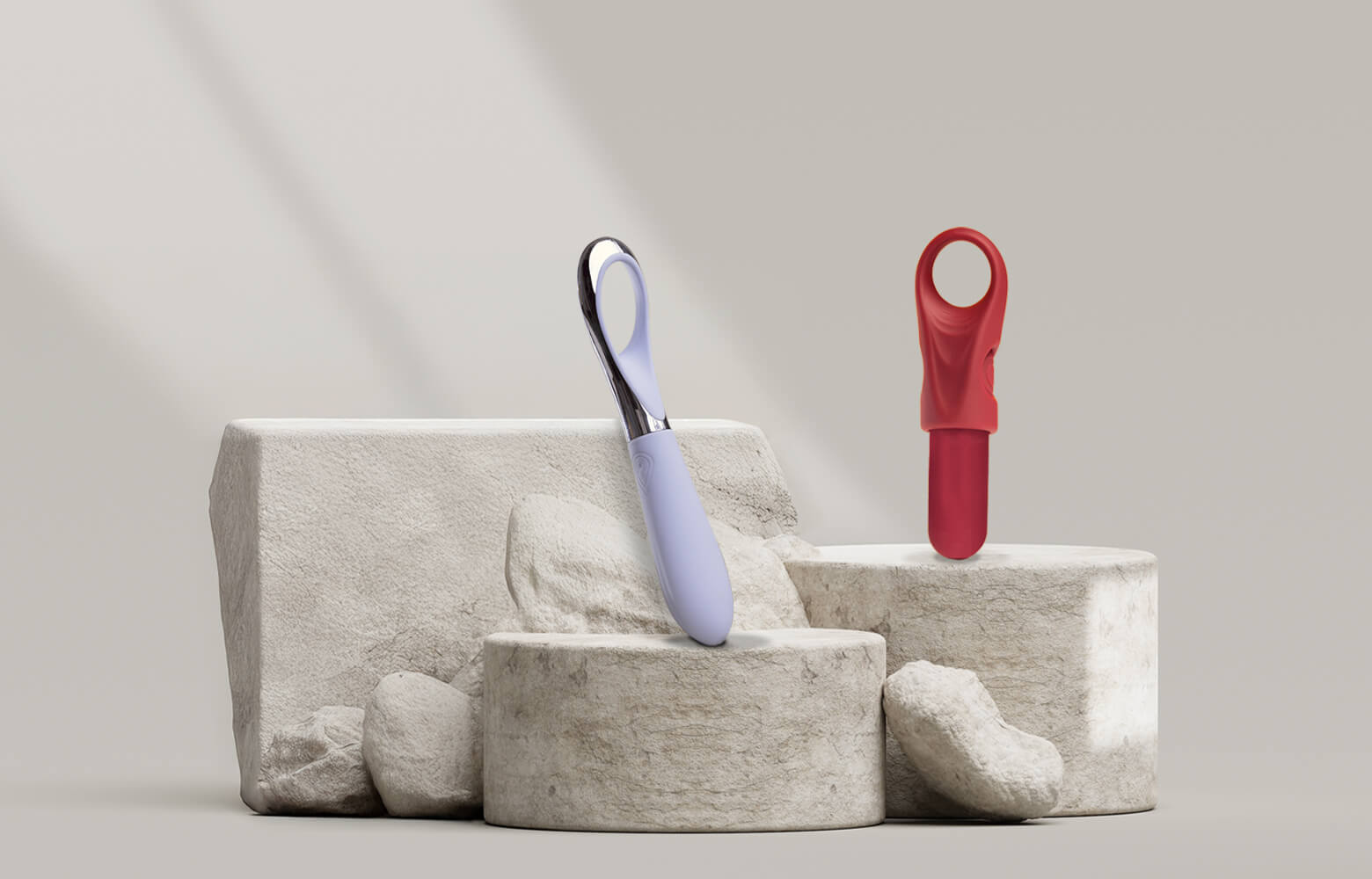 Collection of finger vibrators on a stone podium