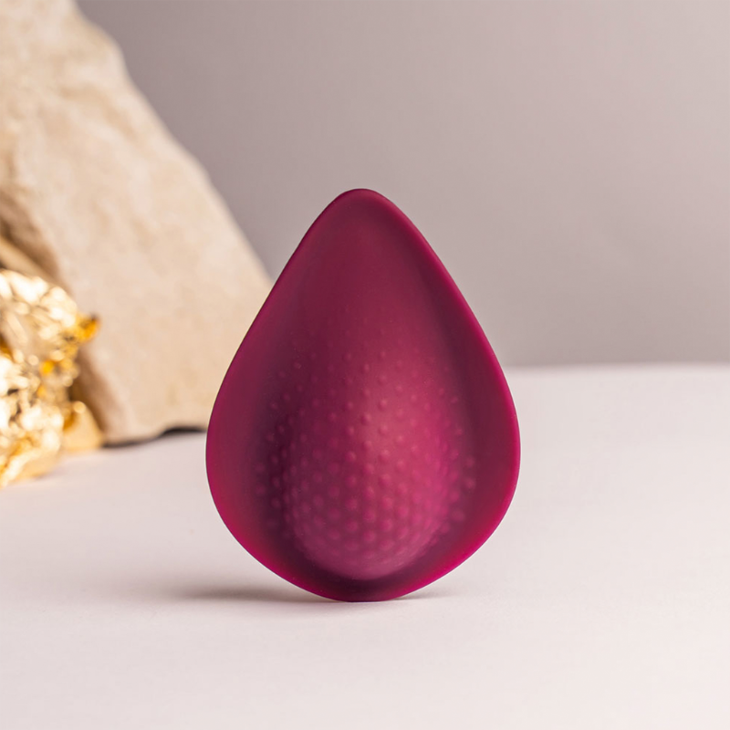 Maroon silicone teardrop massager with raised dot texture