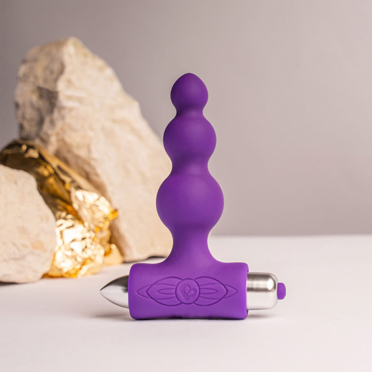 Purple silicone vibrating anal beads with three rounded tips and engraved metal base