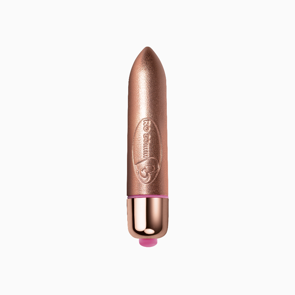 Rose-gold discreet bullet device with tapered tip and dark base
