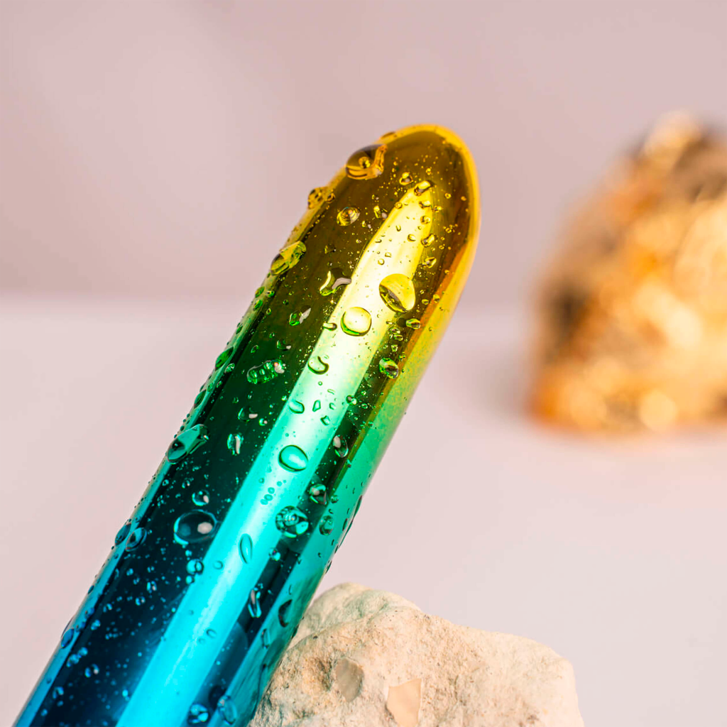 Water-splashed rainbow bullet vibrator with glossy rounded tip