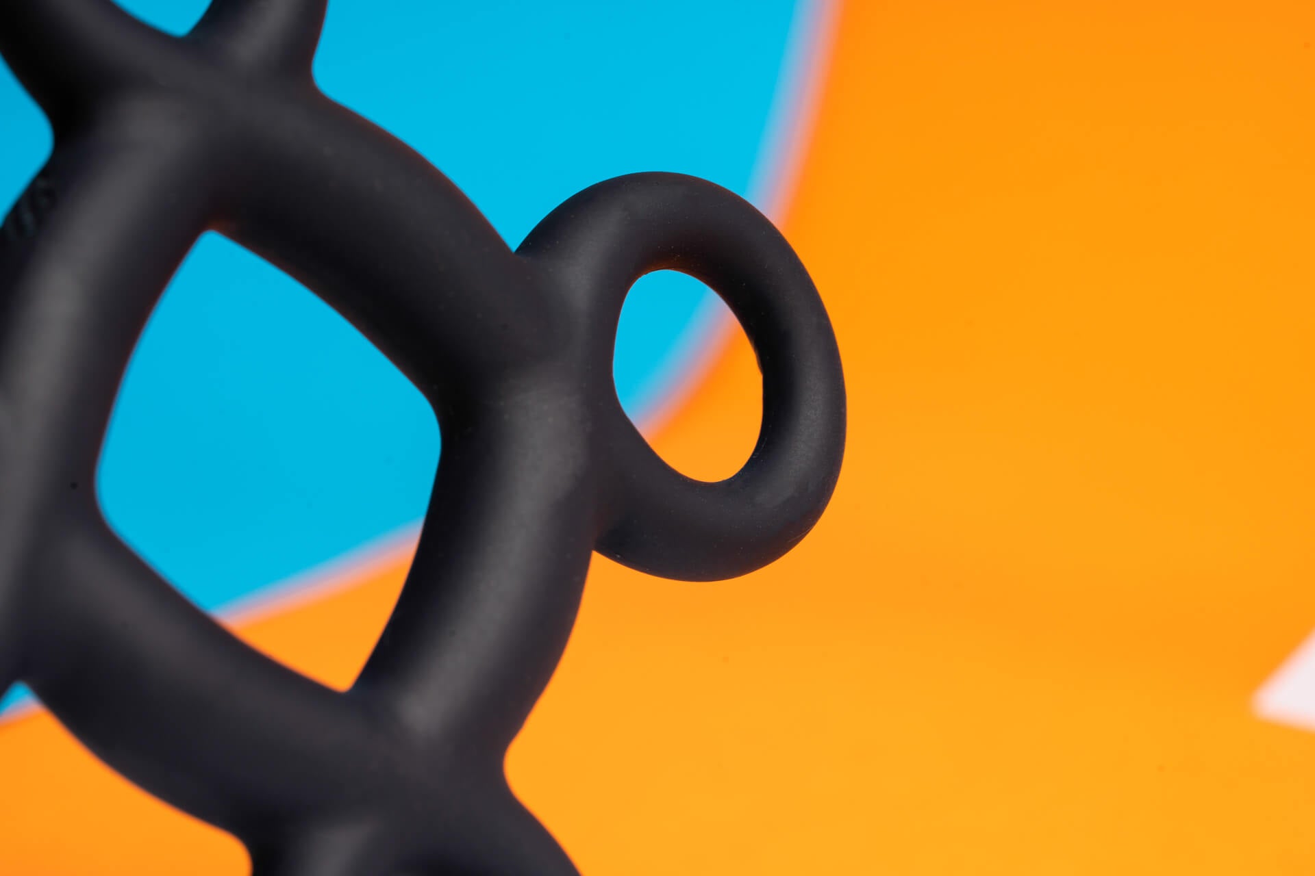 Close up of easy pull finger rings on an accessible cock ring.