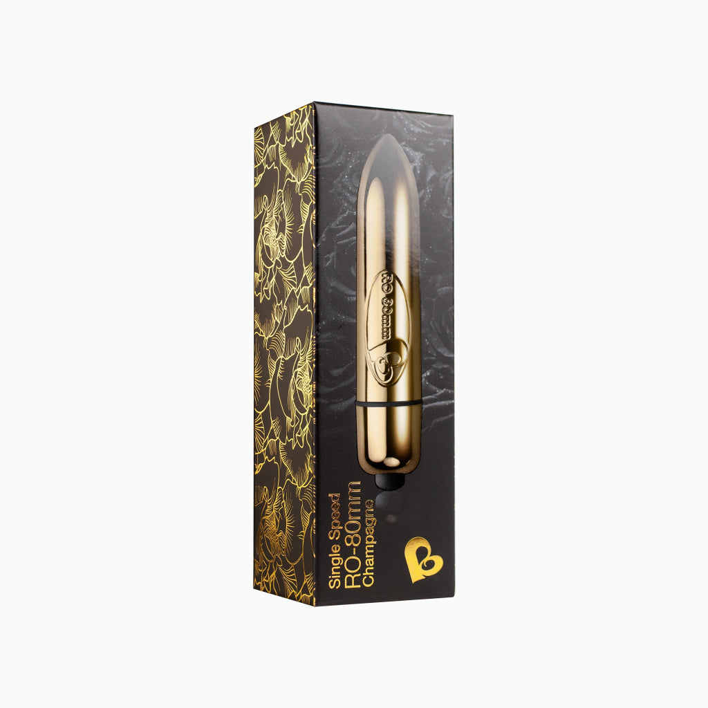 Discreet bullet massager in retail box, gold tone bullet with black base