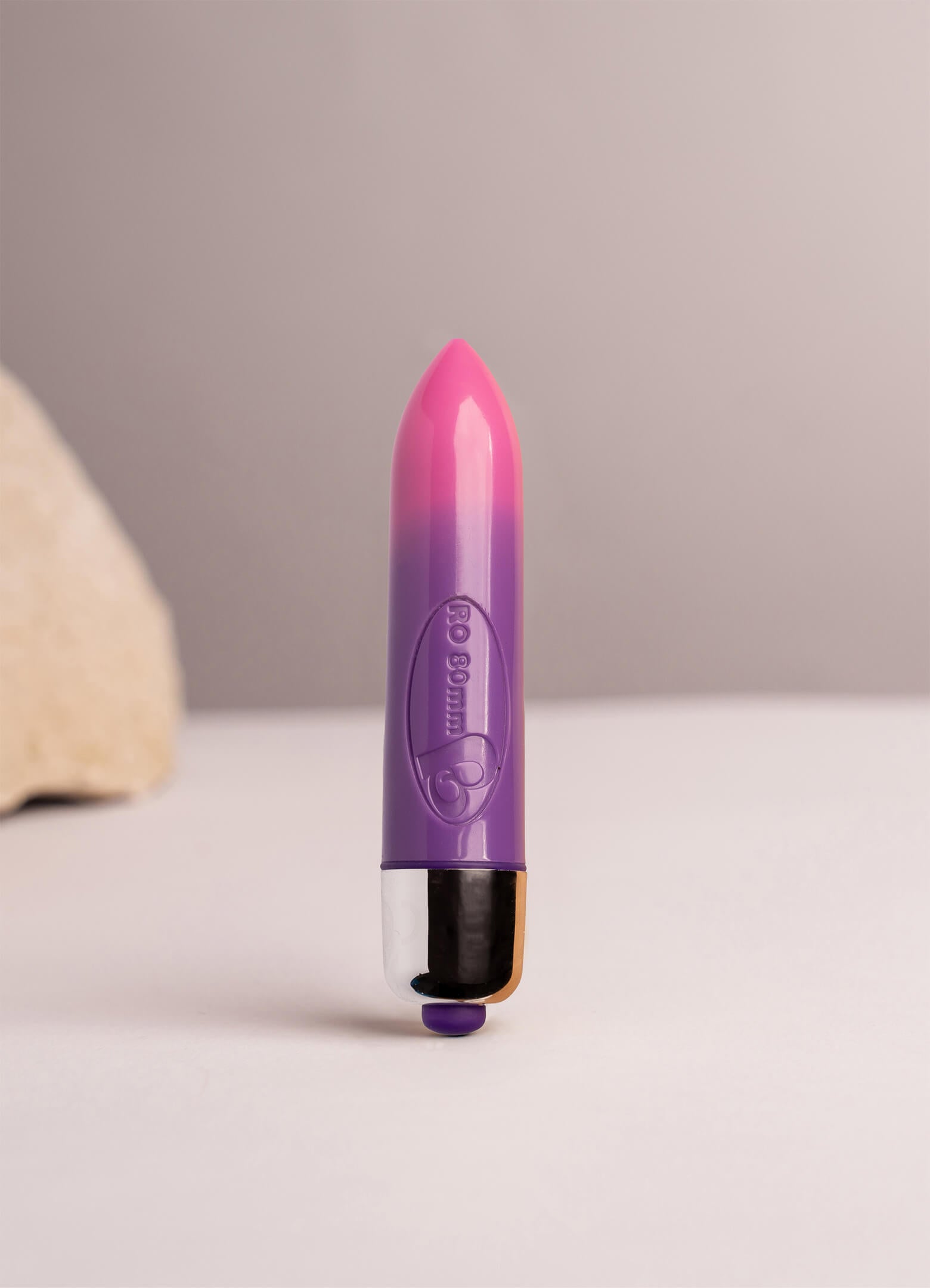 Small bullet vibrator in colour changing pink and purple.