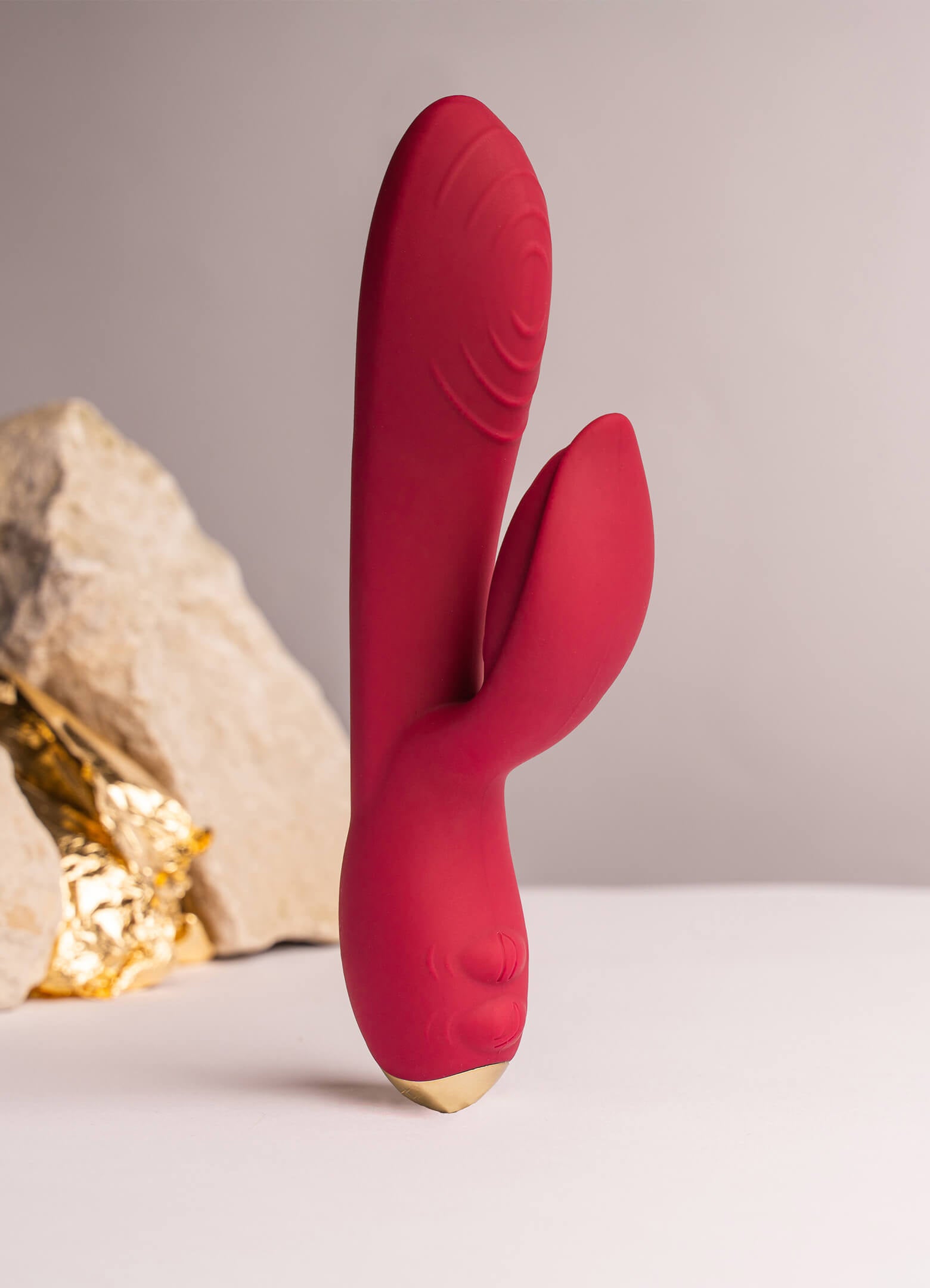 Burgundy rabbit vibrator with petal shape ears.