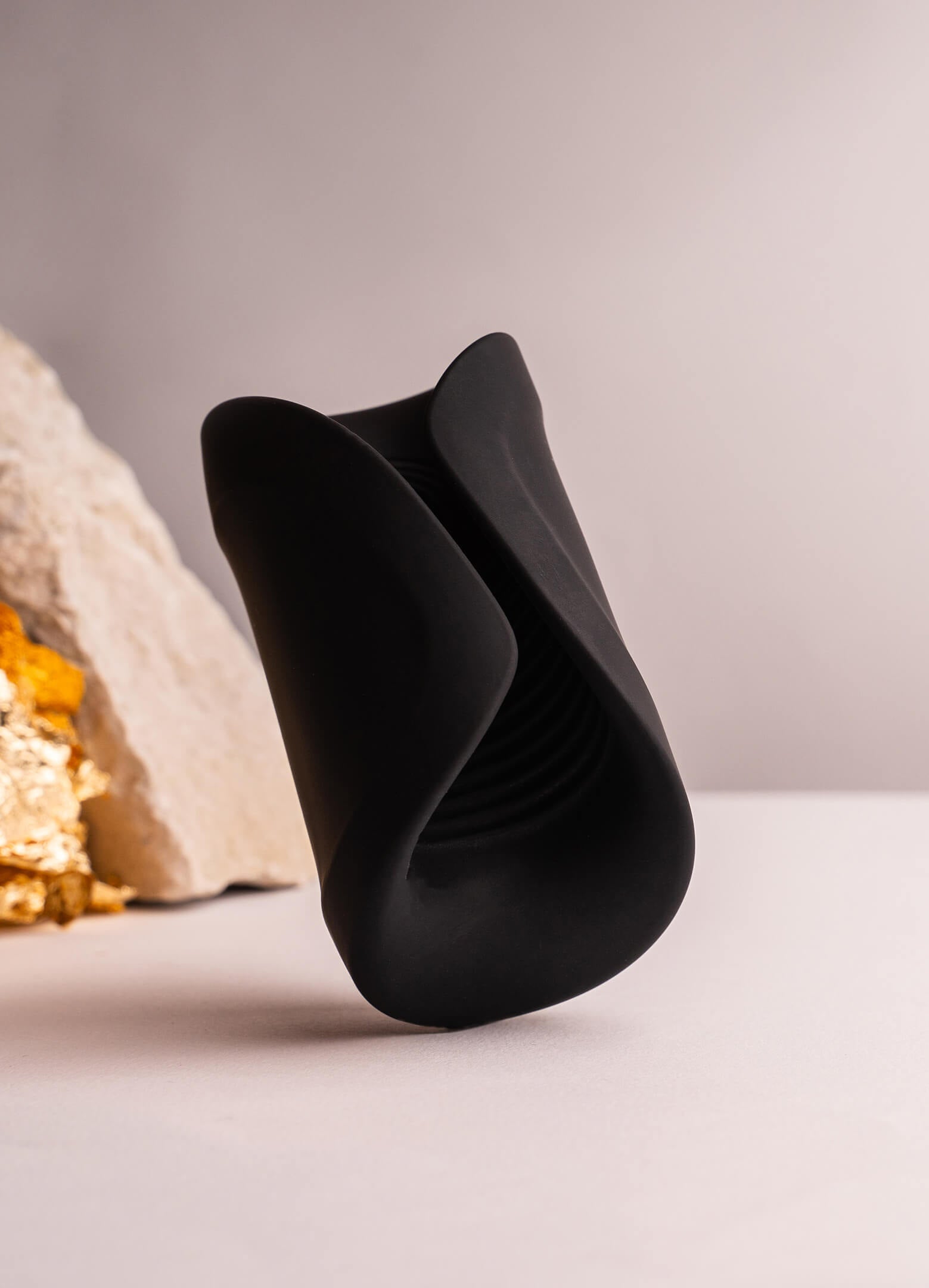 Vibrating flexible silicone masturbator in black.