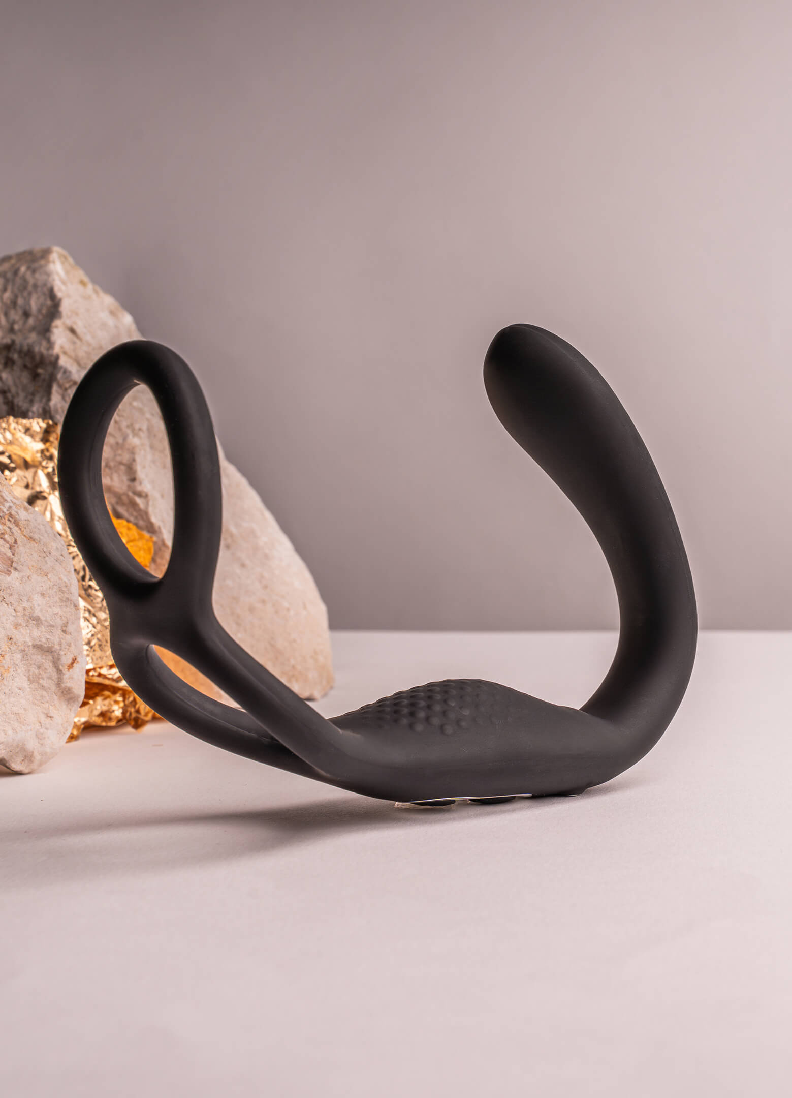 Flexible anal tail with a cock and ball ring attached.