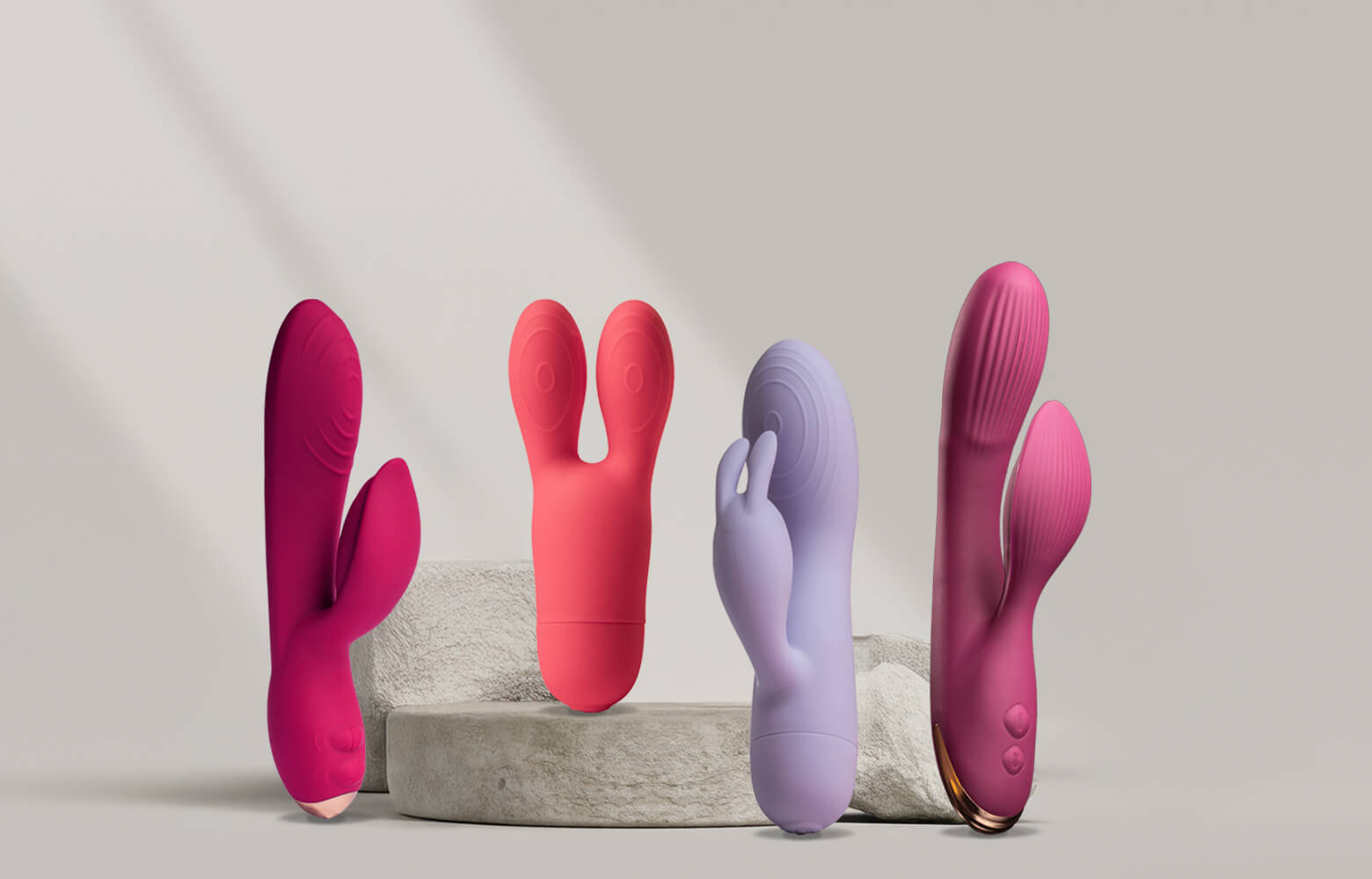 Collection of rabbit vibrators a stone podium various sizes and colours