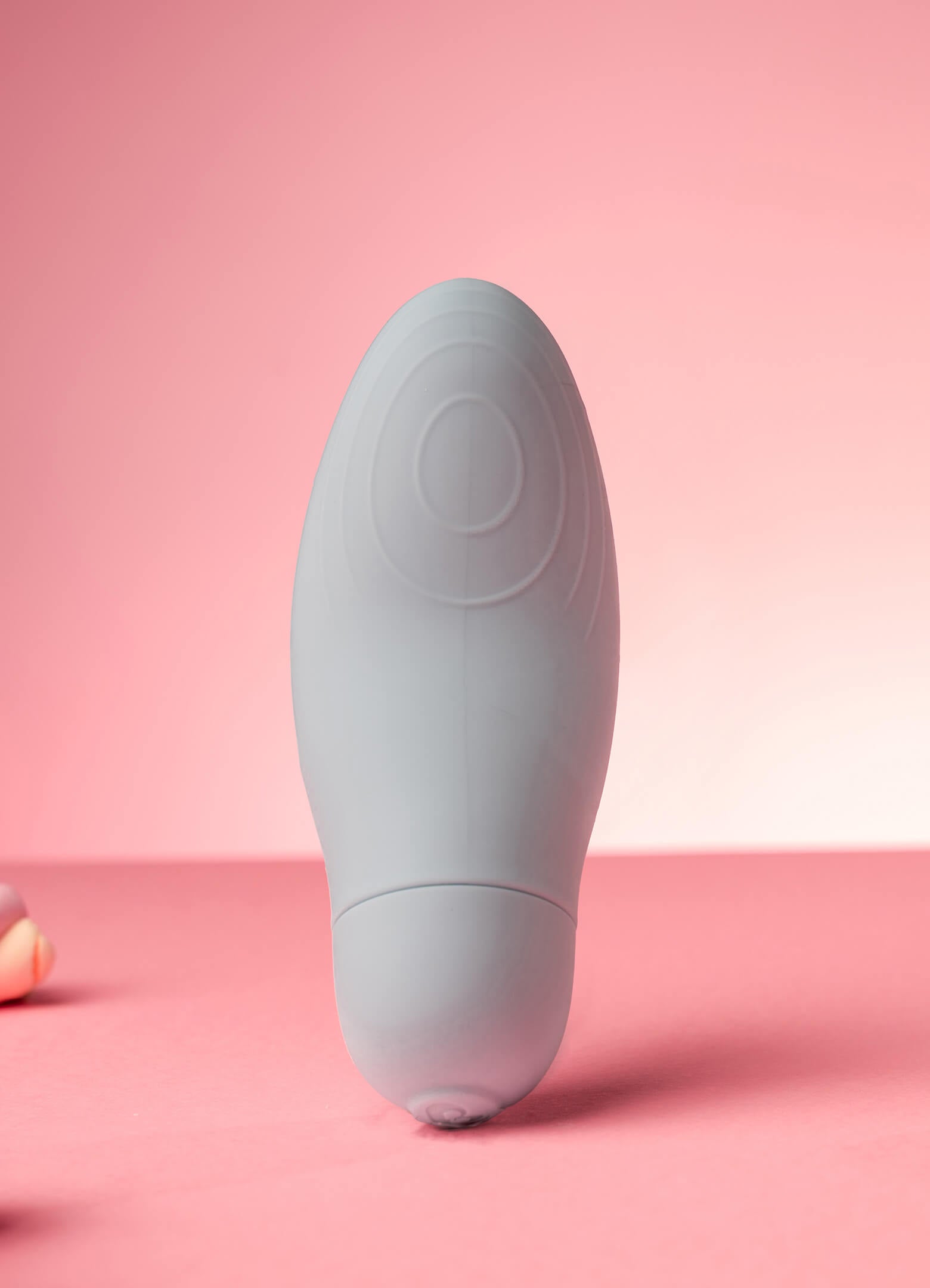 Discreet external massager vibrator in light blue.
