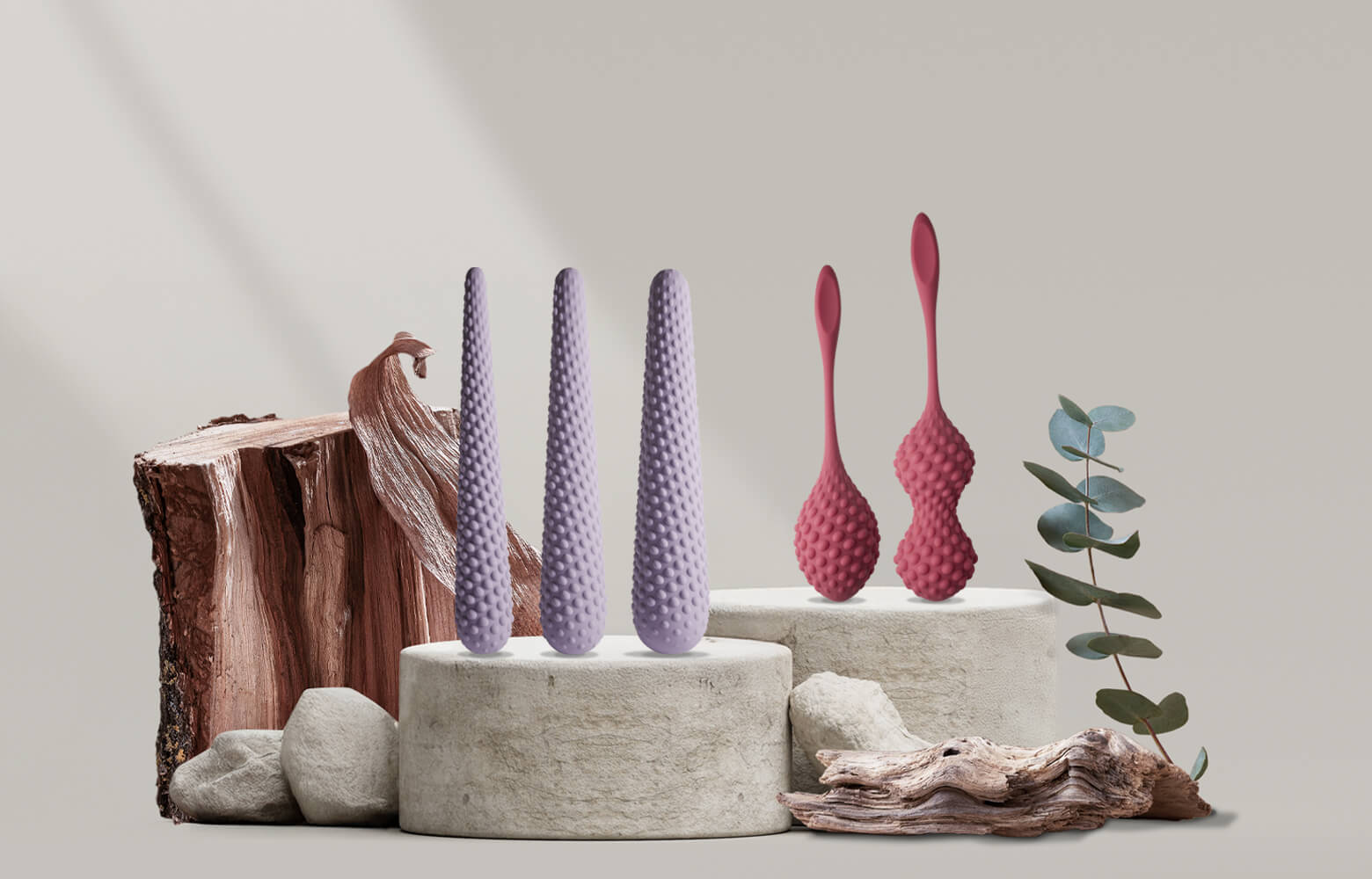 Collection of unite products on a stone podium including dilators and kegals