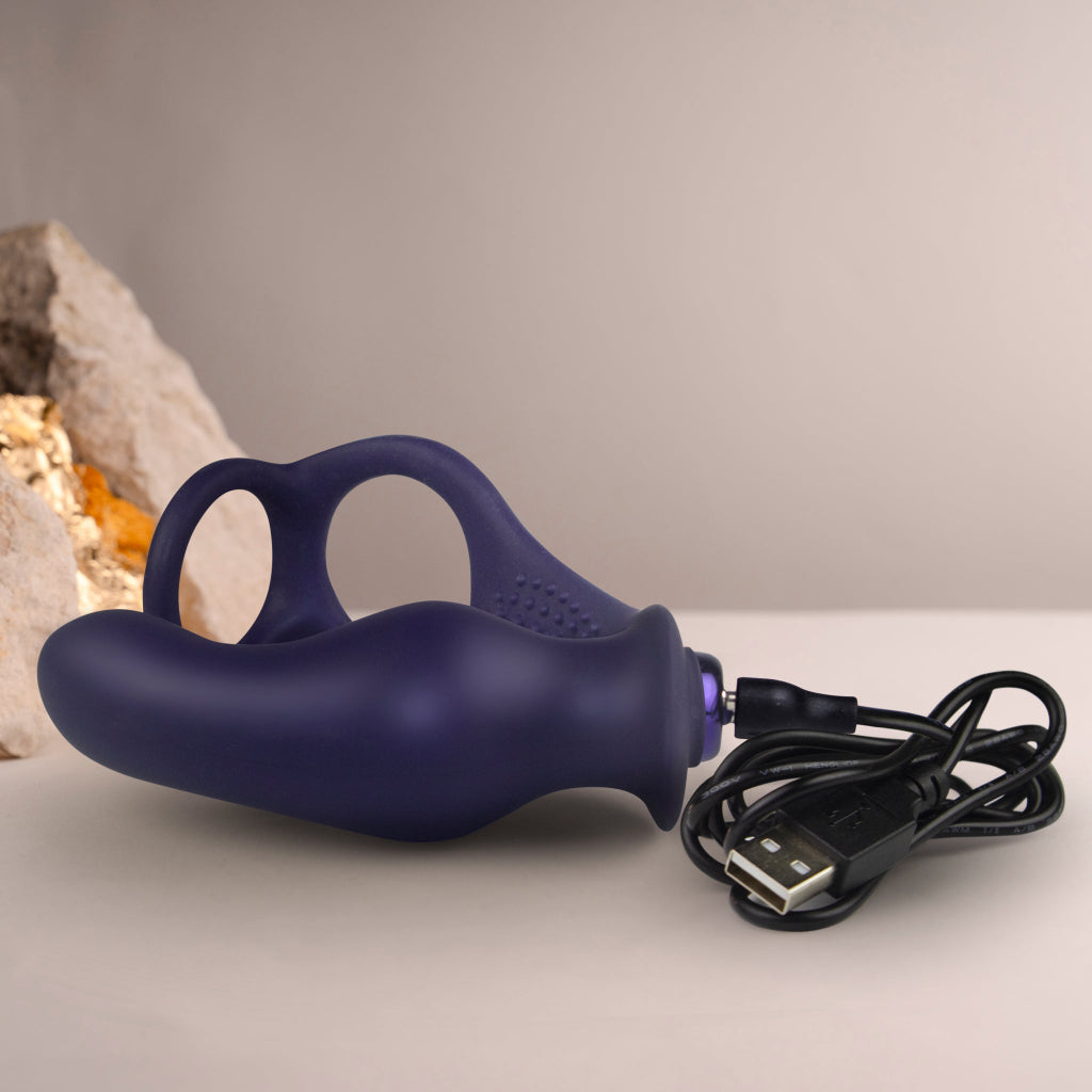 NOVA Zenturian 16-function prostate plug shown next to a hand for size reference, displaying the compact and ergonomic design