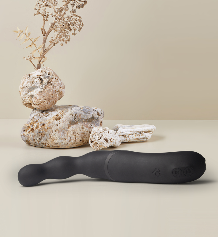 Black prostate and anal massager with long curved body and buttoned control end