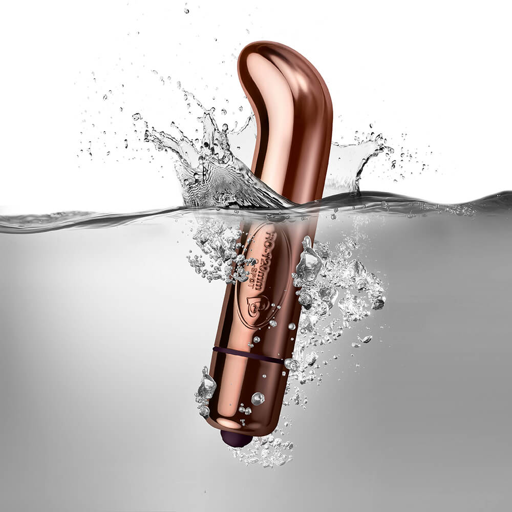 Rose Gold G-Spot Vibrator half submerged in water