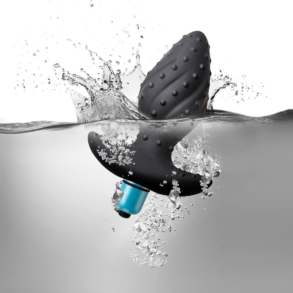 Vibrating Butt Plug half submerged in water