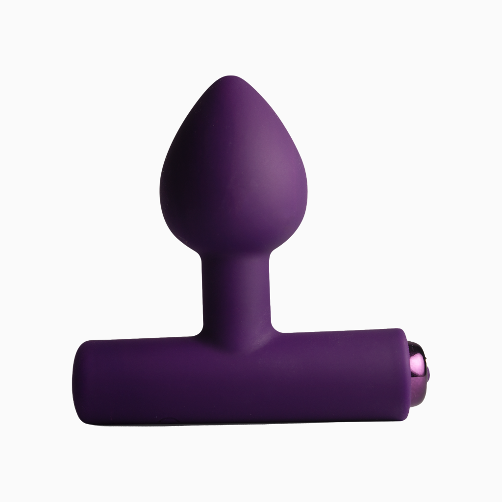 Purple silicone plug front view, tapered tip and flared base with side charging port