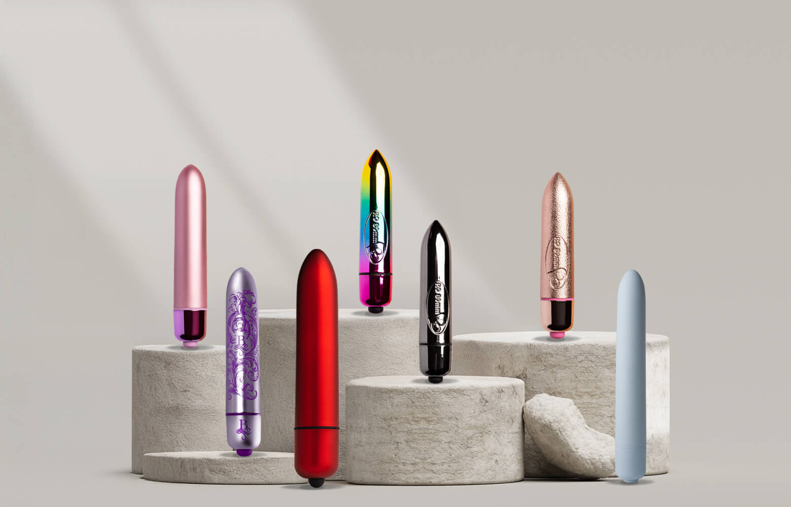 Collection of various sized bullet vibrators on a stone podium including 80mm, 120mm and 140mm