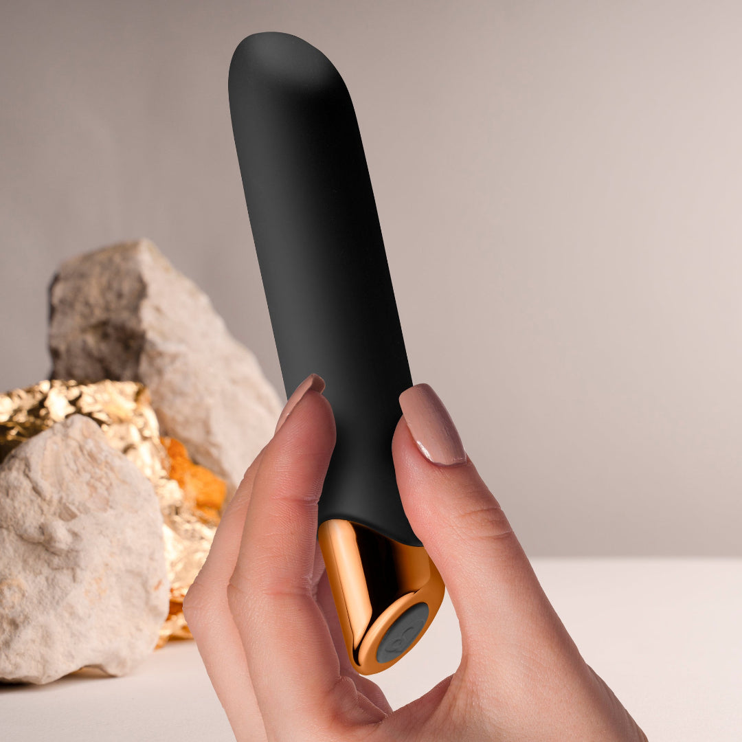 Rocks Off Chaiamo - Classic Powerful Vibrator - black in hand with tactical rock to give an idea of scale