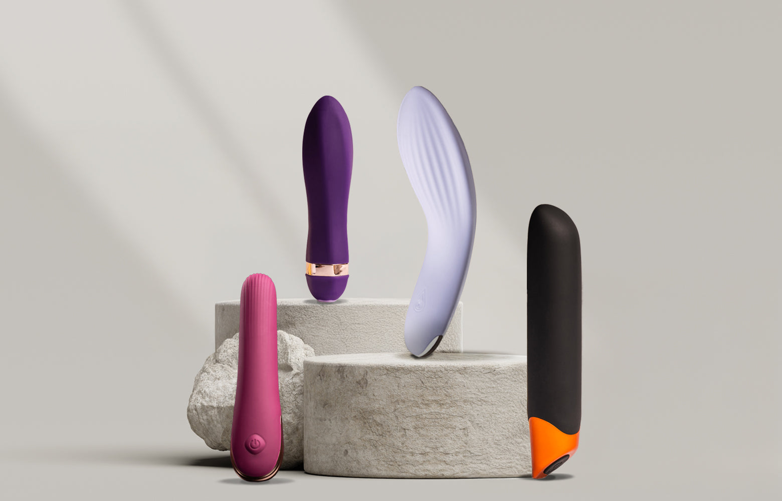 Collection of classic vibrators on a stone podium including th echaiamo