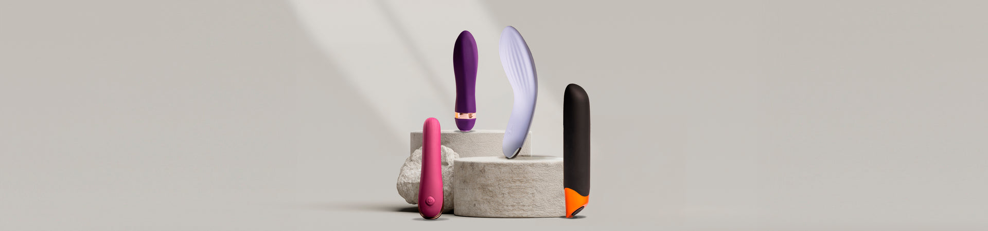 Collection of classic vibrators on a stone podium