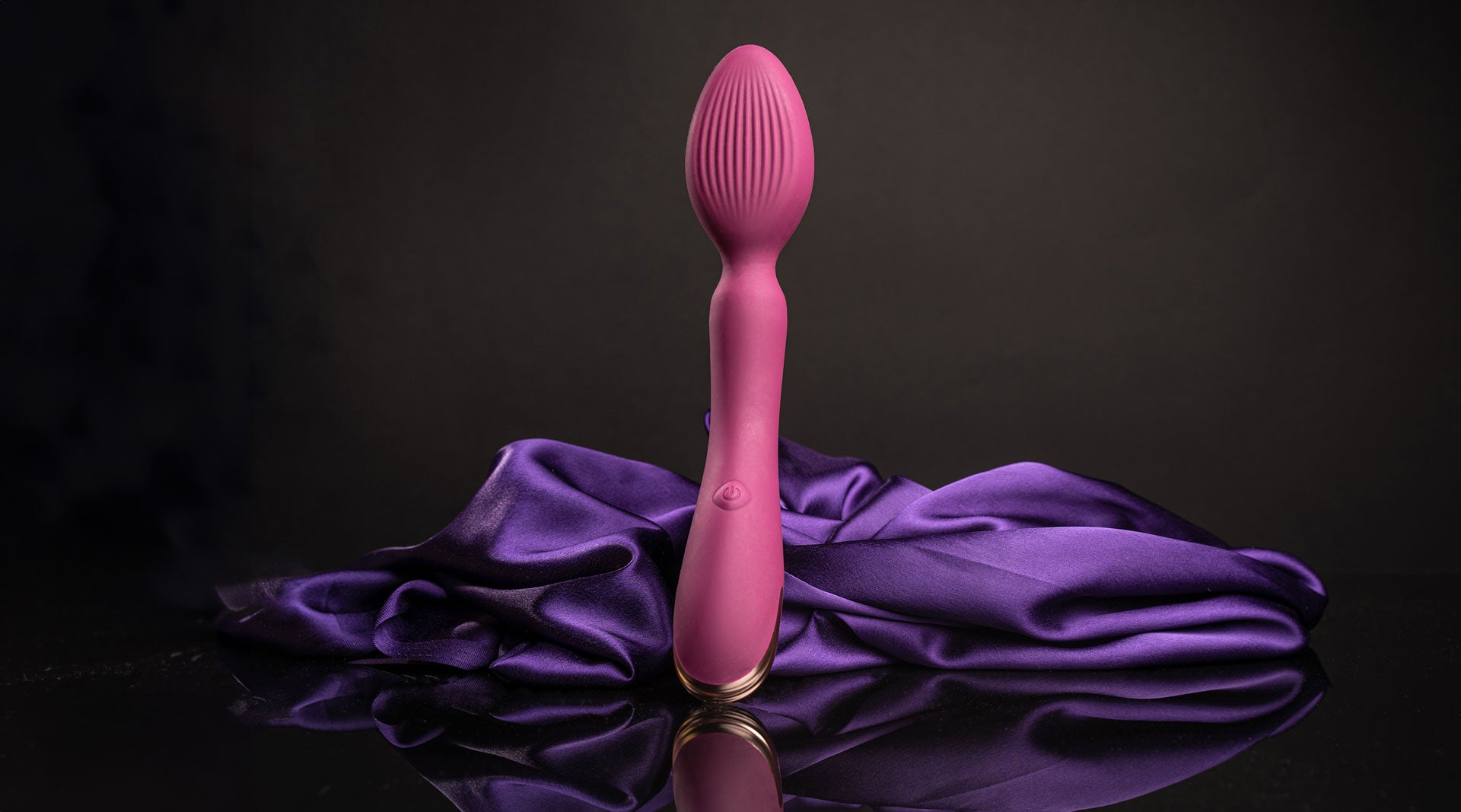 Burgundy egged shaped head wand vibrator with a ribbed surface.