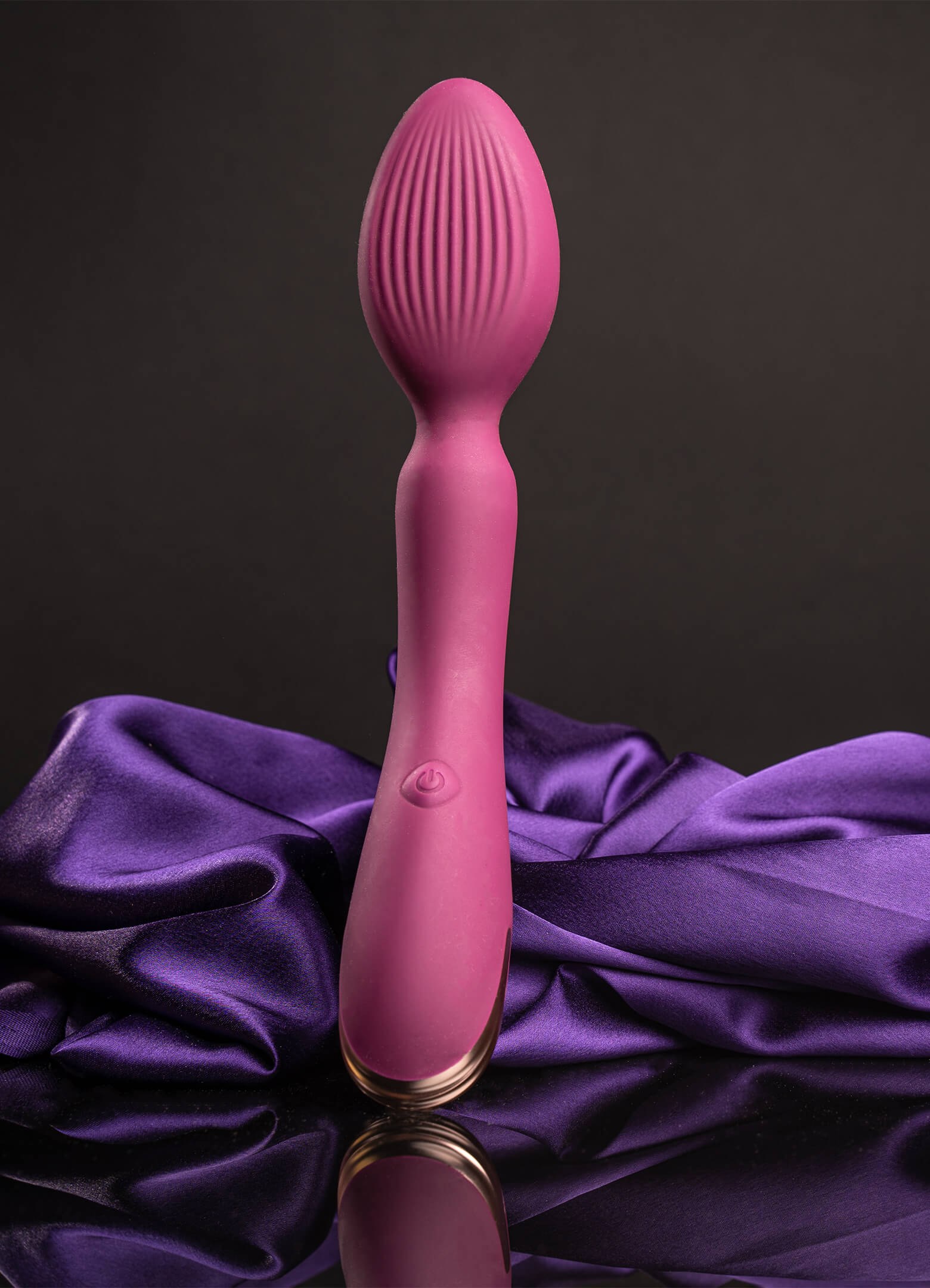Burgundy egged shaped head wand vibrator with a ribbed surface.
