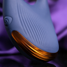 Navy blue ribbed silicone wearable device with gold inner edge and side button