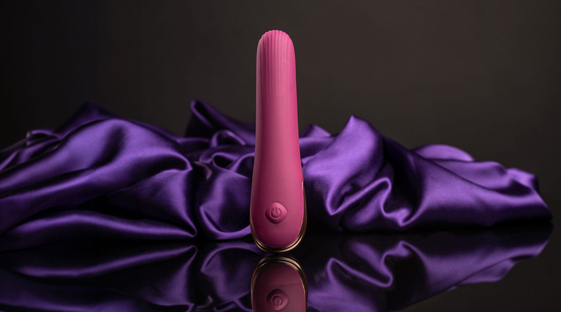 Small discreet burgundy vibrator with a ribbed tip.