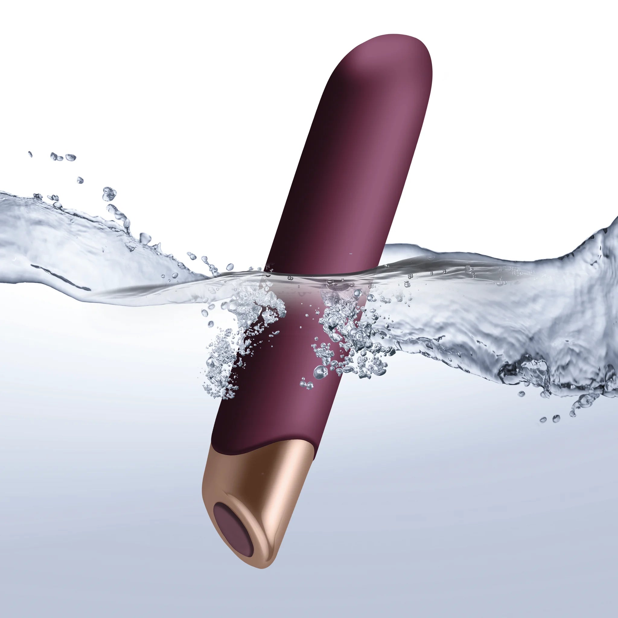 Purple vibrator wand partly submerged under water splash with metallic base.
