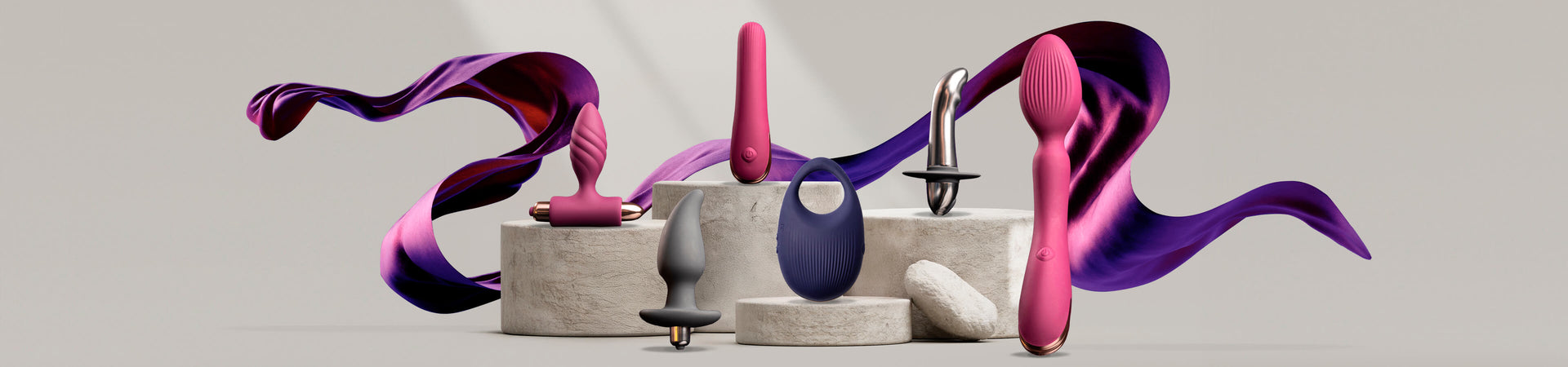 Collection of climaximum products on a stone podium including protate toys, wand and c-ring