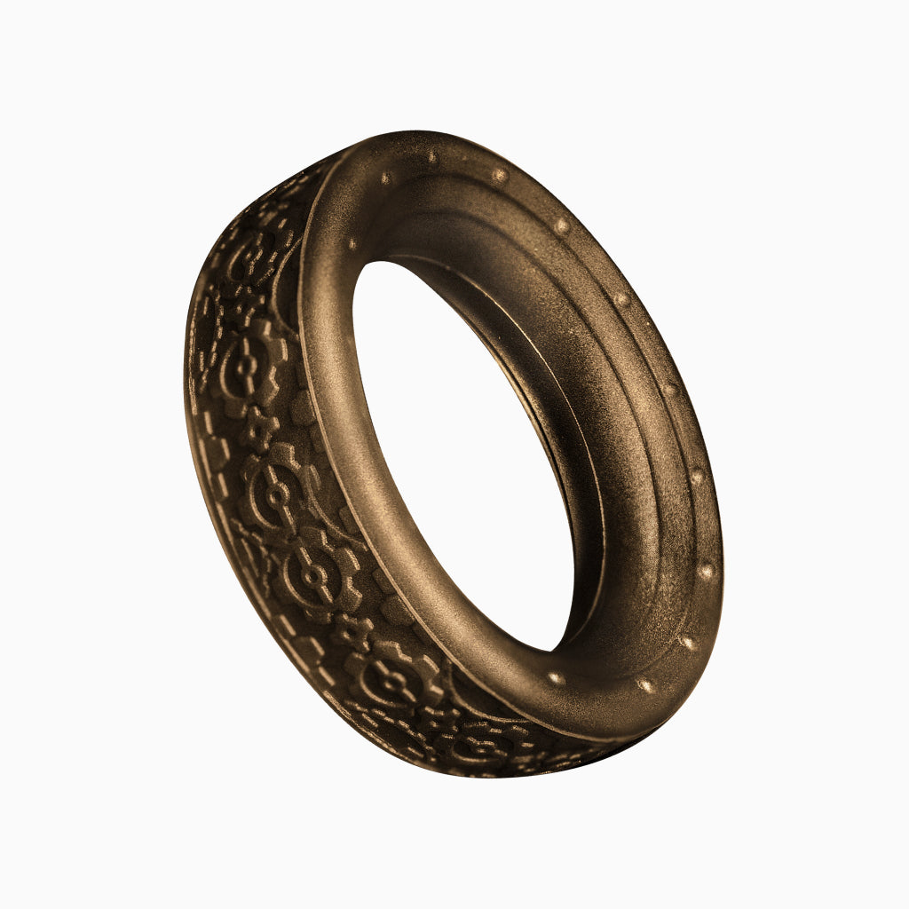 Bronze cock ring with raised patterned texture and oval opening