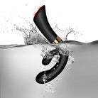 Waterproof FUZION Enigma vibrator partially submerged in clear water spray