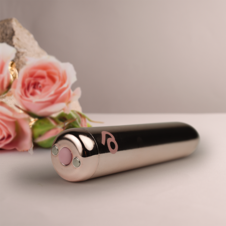 Rose-gold rechargeable bullet vibrator with glossy black head and smooth body