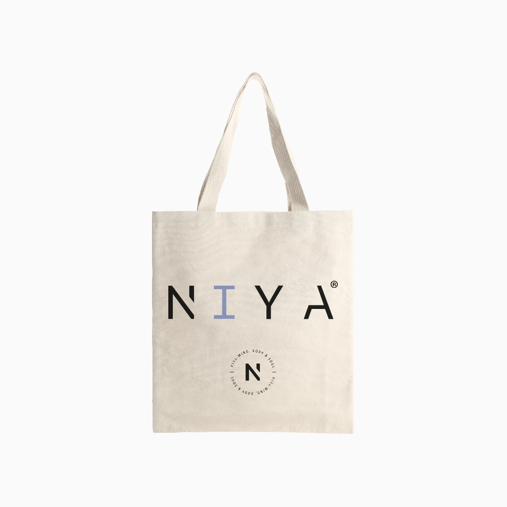 Cotton tote bag in off-white with NIYA logo print and short handles