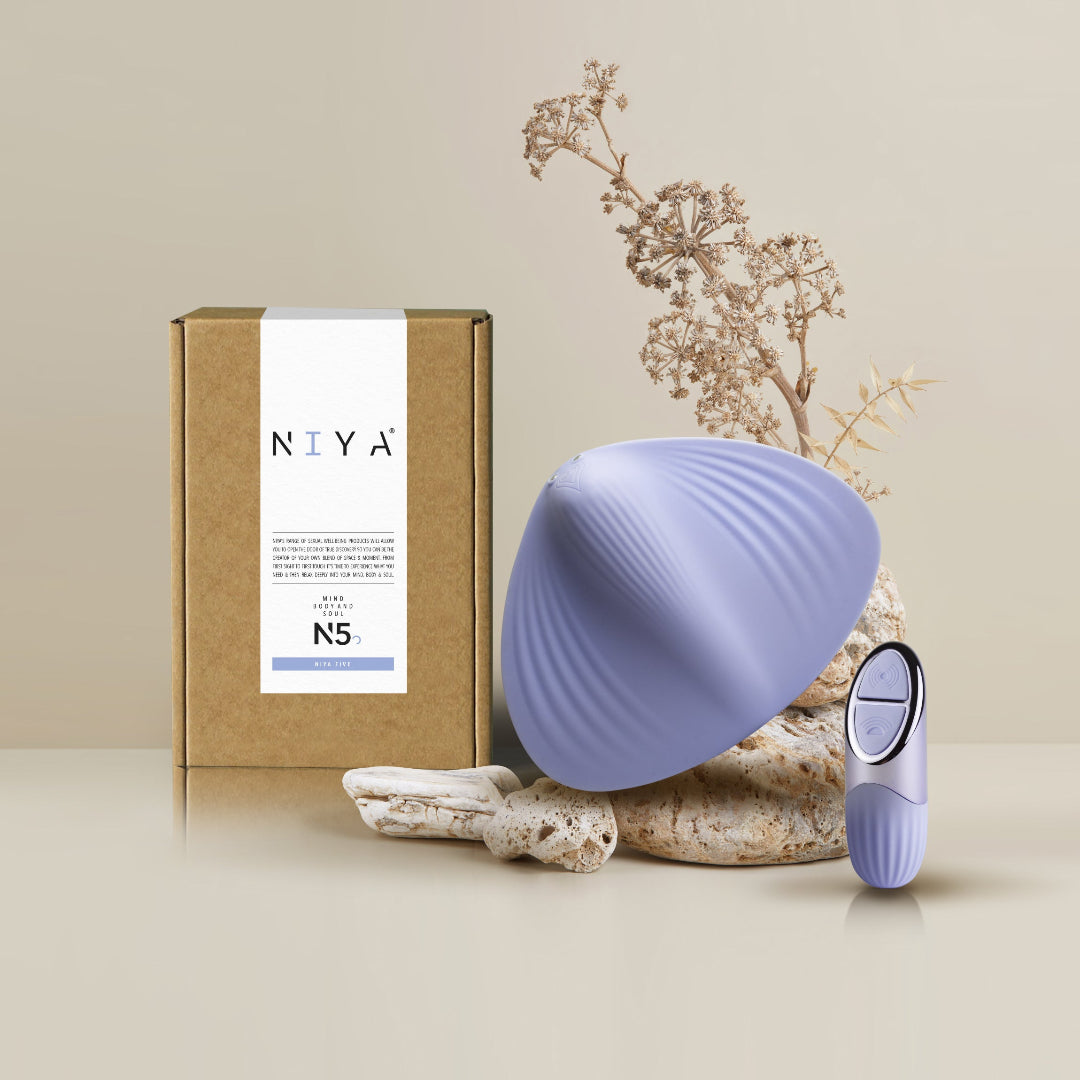 Purple NIYA N5 panty vibe with packaging and decorative elements on a beige background