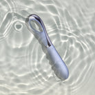 Niya Finger Vibe with a light blue silicone body and a metallic silver handle, shown in water to show water proof design