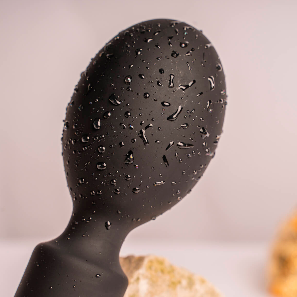 Black rechargeable wand head with water droplets, rounded silicone design