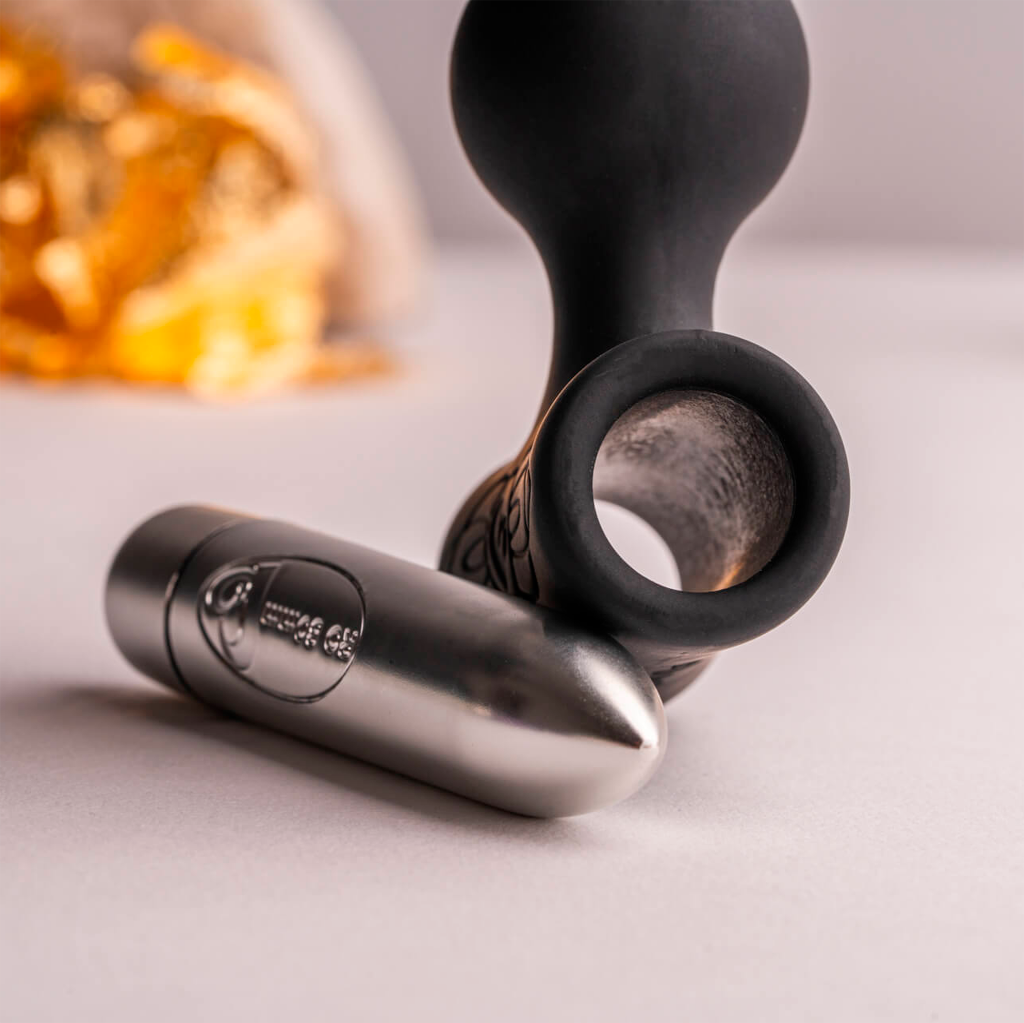 Black vibrating anal beads with metal end cap and sculpted bulb handle base