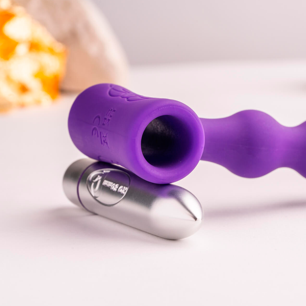 Purple vibrating anal toy with controller and silver handle
