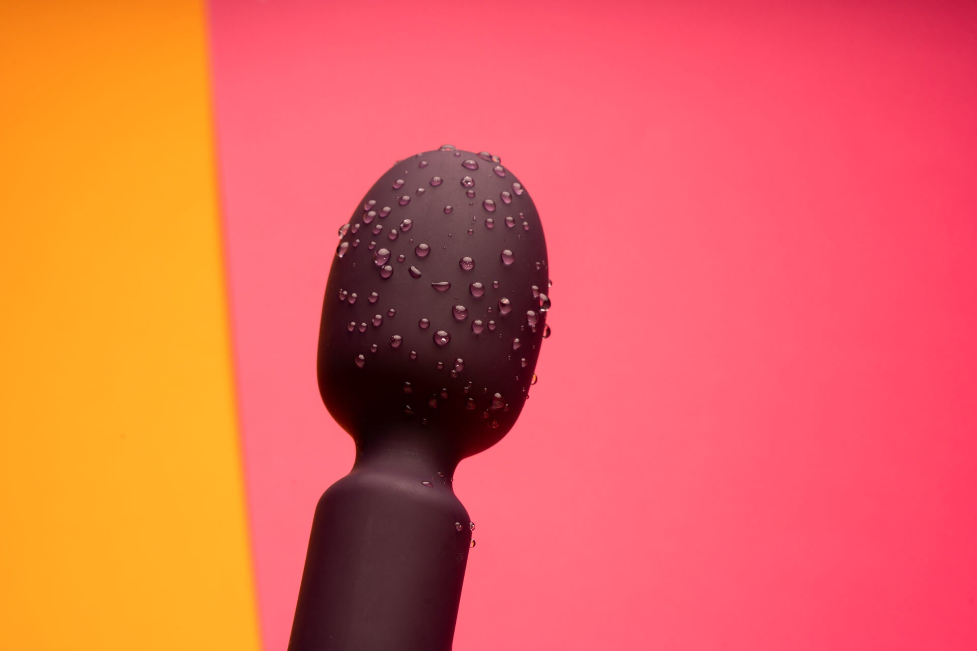 Water droplets on the massager showing waterproof accessible wand vibrator.
