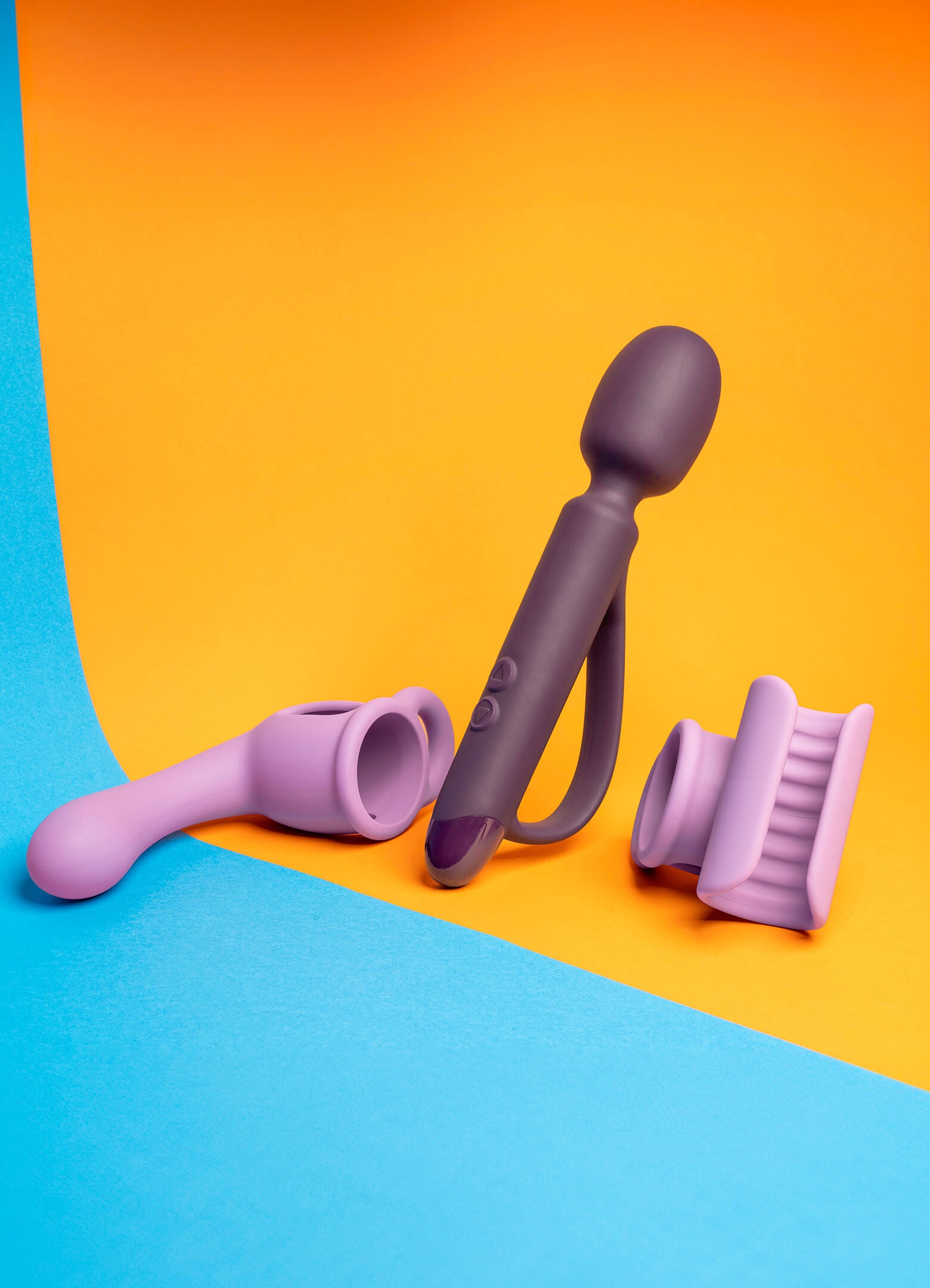Plum purple wand vibrator with an accessible handle with separate lilac masturbator and G-spot/prostate attachments.