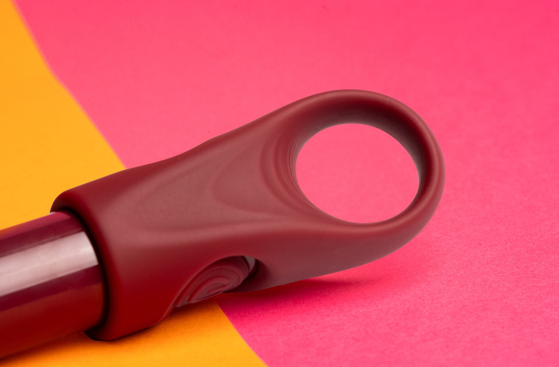 Ergonomic finger loop with easy access power button on the side.