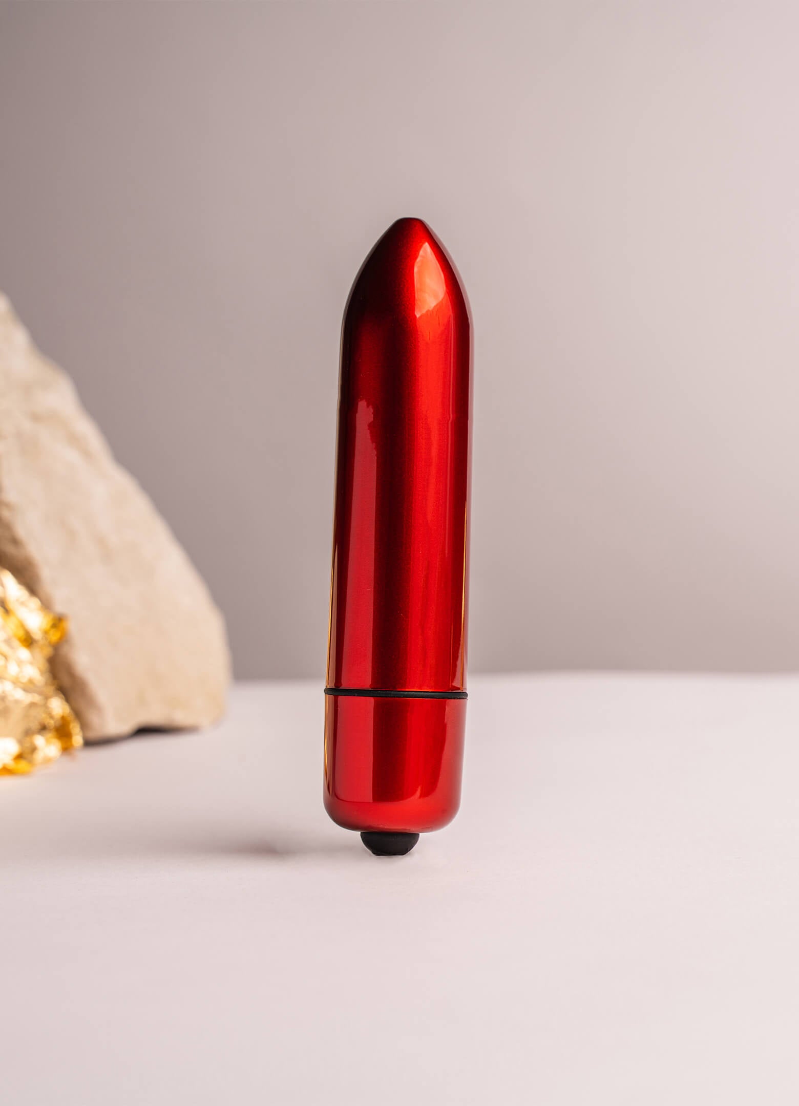 Medium sized girthy bullet vibrator in gloss red.