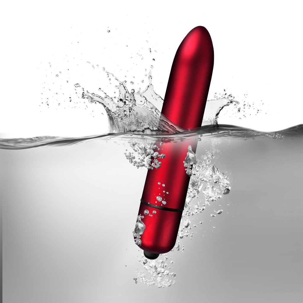 Red lipstick bullet with water splash and droplets