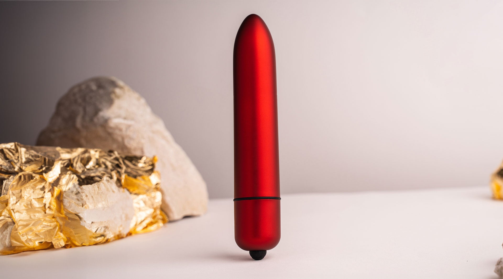 Large insertable bullet vibrator in matt red.