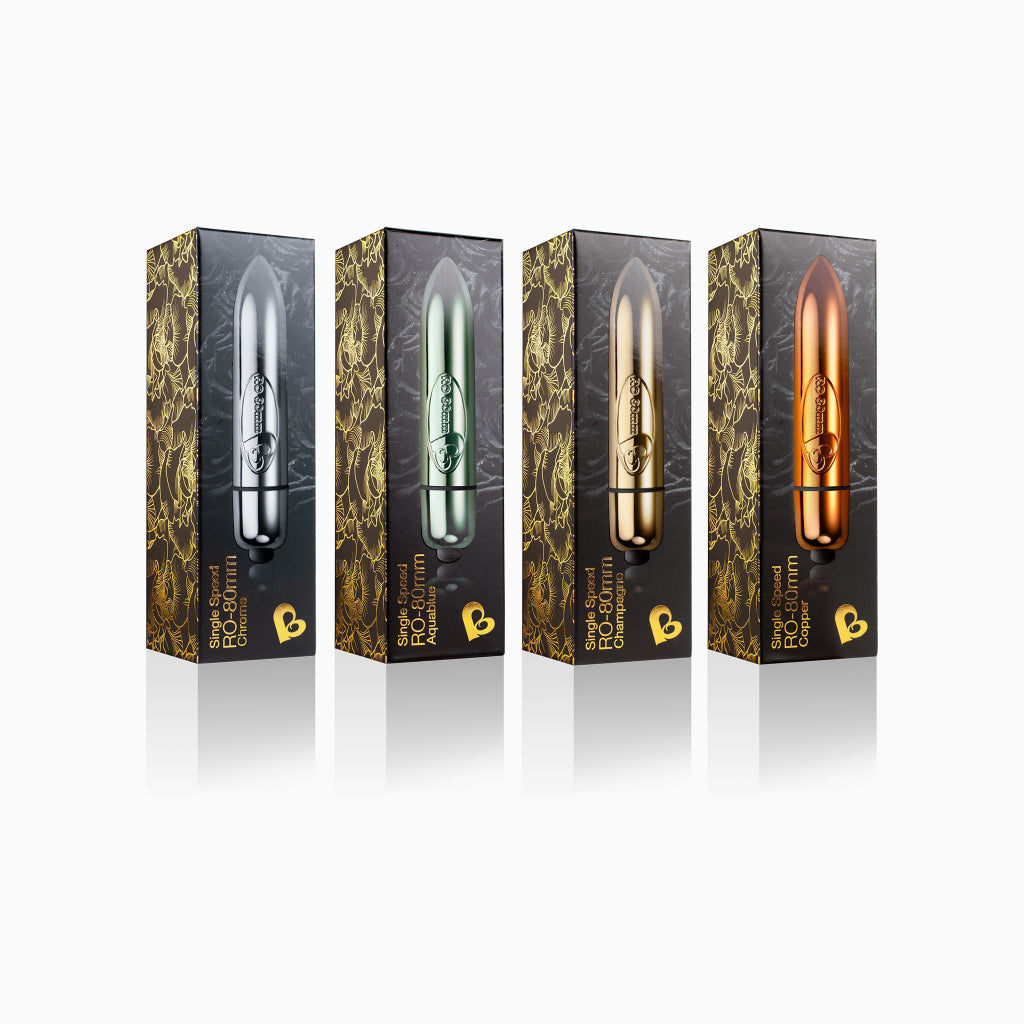 Four boxed discreet bullet devices showing silver, green, champagne, and copper finishes