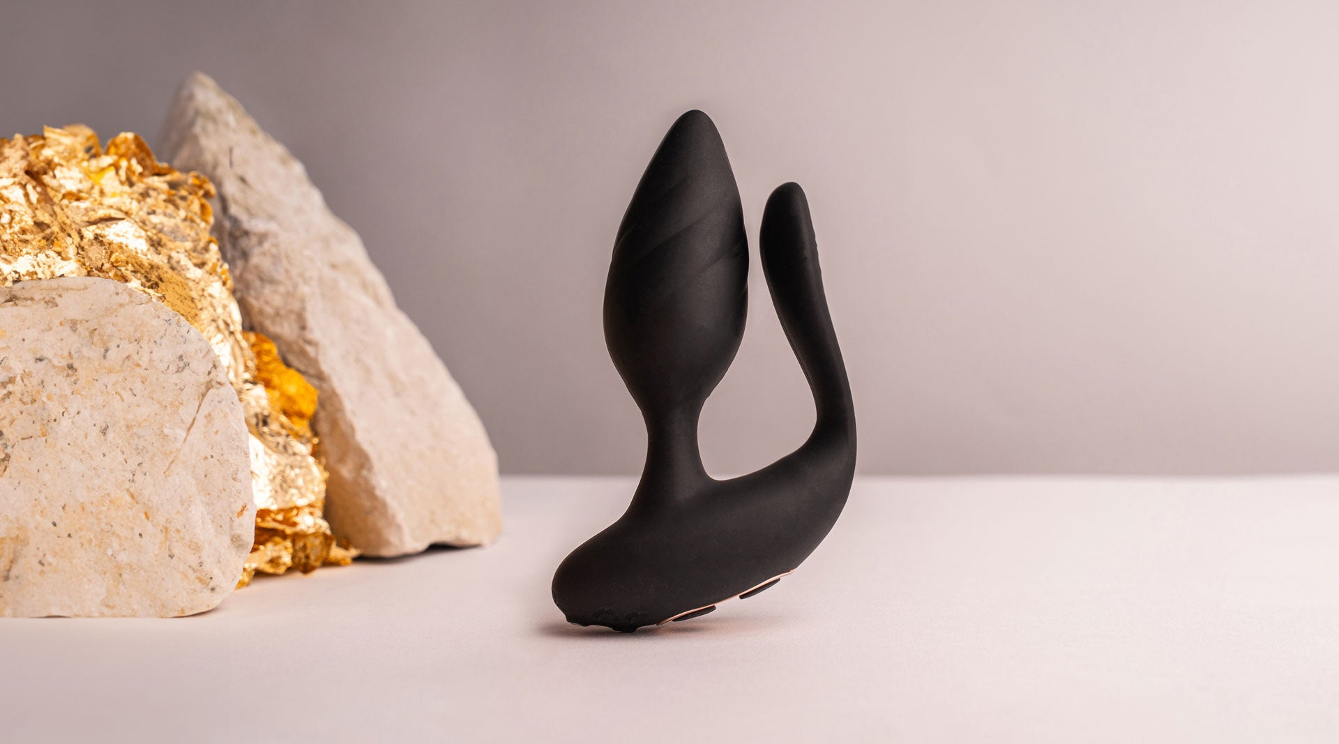 Black silicone butt plug with an insertable vaginal tail.