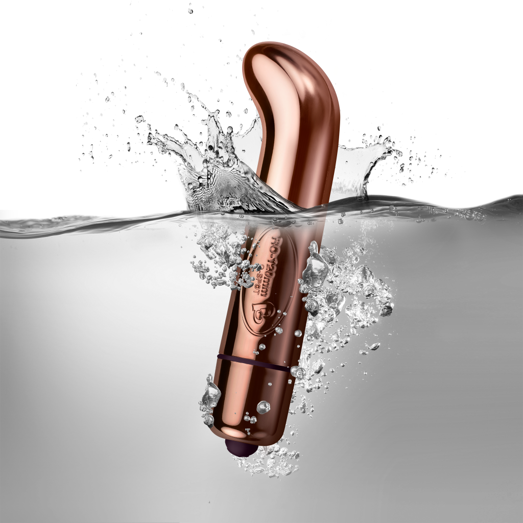 RO-G-Spot g-spot massager, rose-gold curved body with purple base, shown in water splash